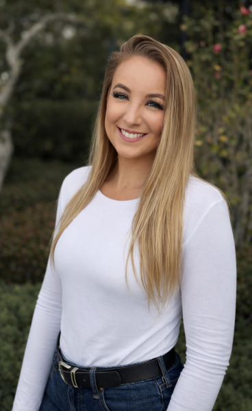 Smiling portrait in garden sunlight